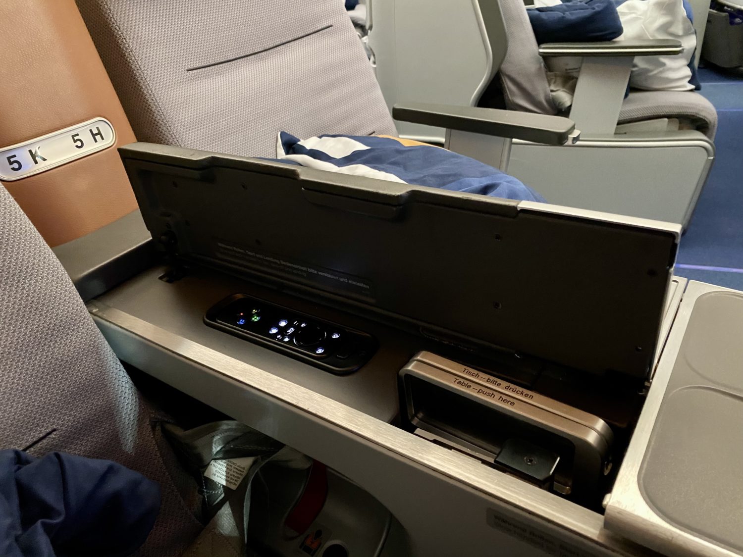 tray table and remote underneath a flap