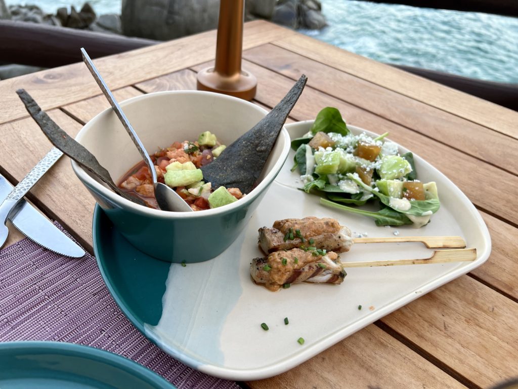 several dishes on a purple placemat