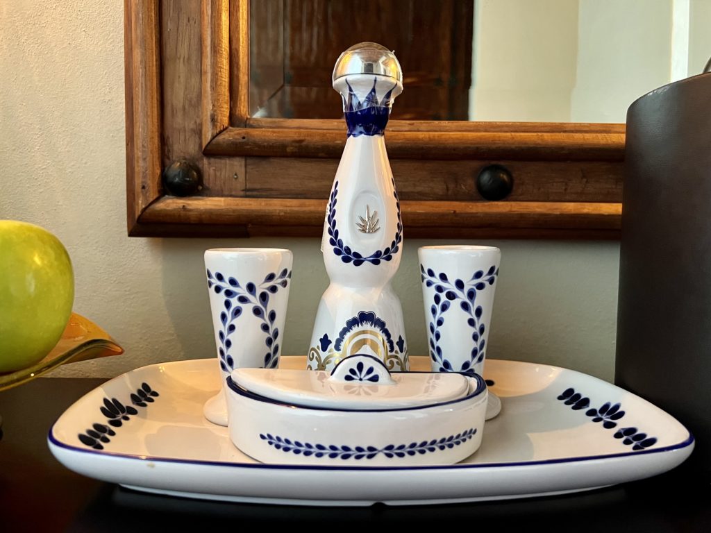 a blue and white bottle of liquor