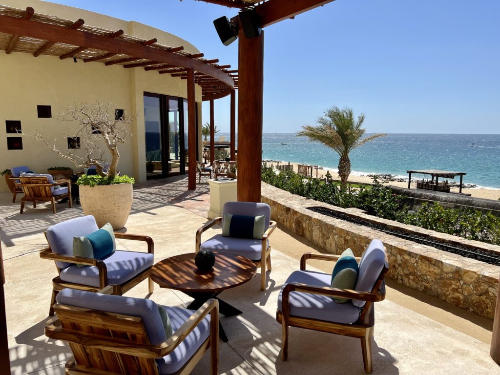 four wooden chairs surrounding a circular table