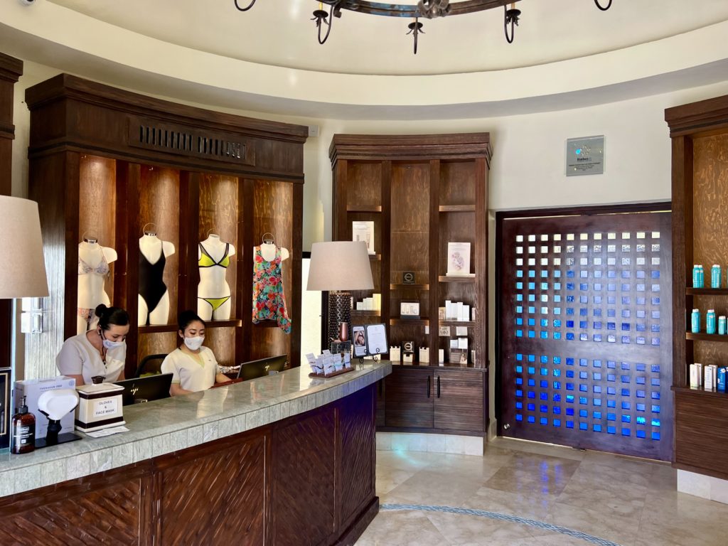 two women standing behind a counter