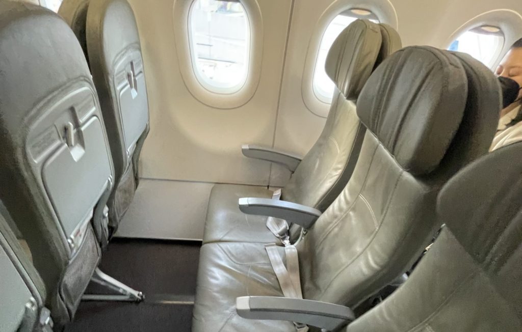 airplane seat with generous legroom 