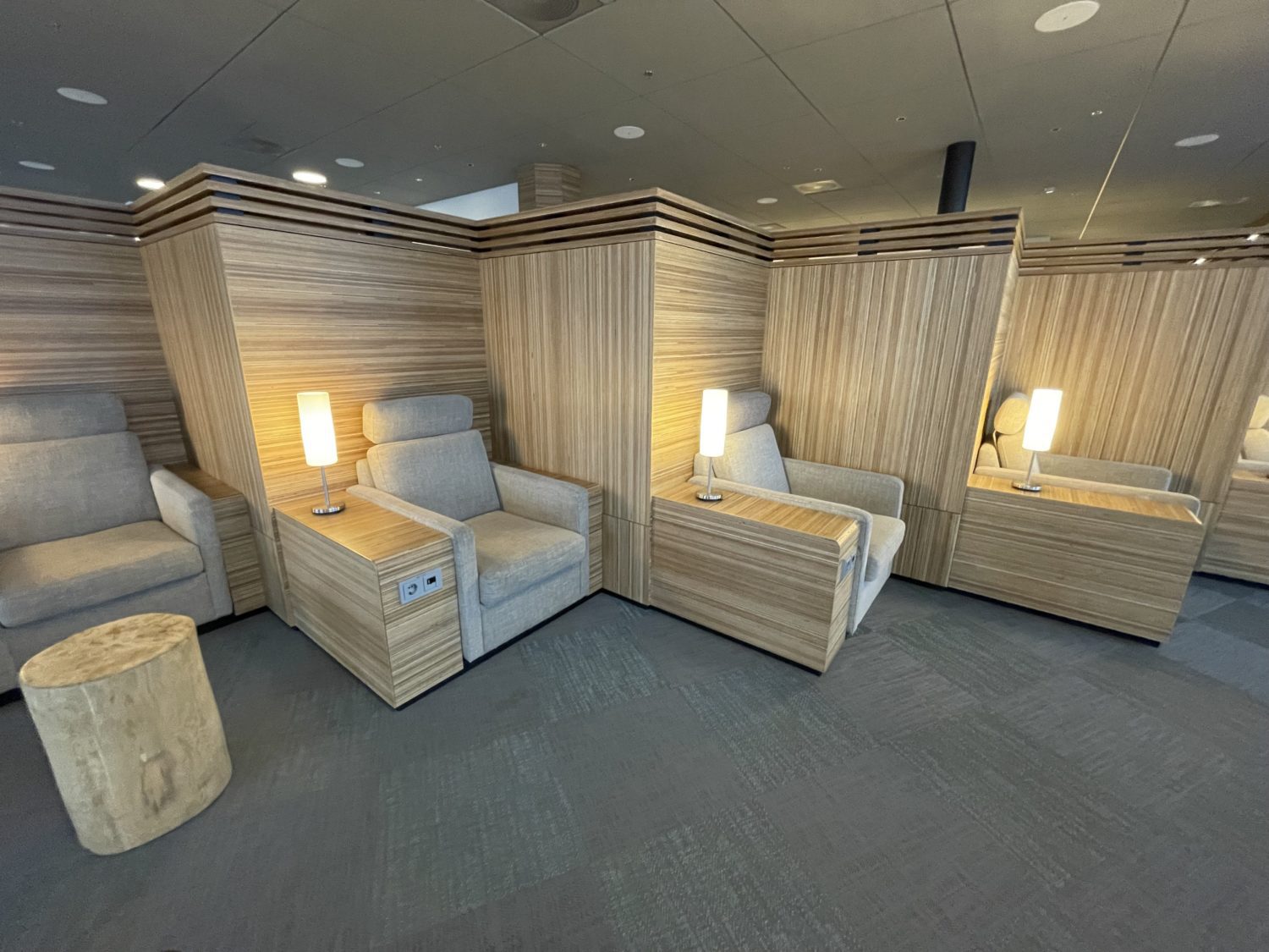 Lounge seating surrounded by wooden design. 