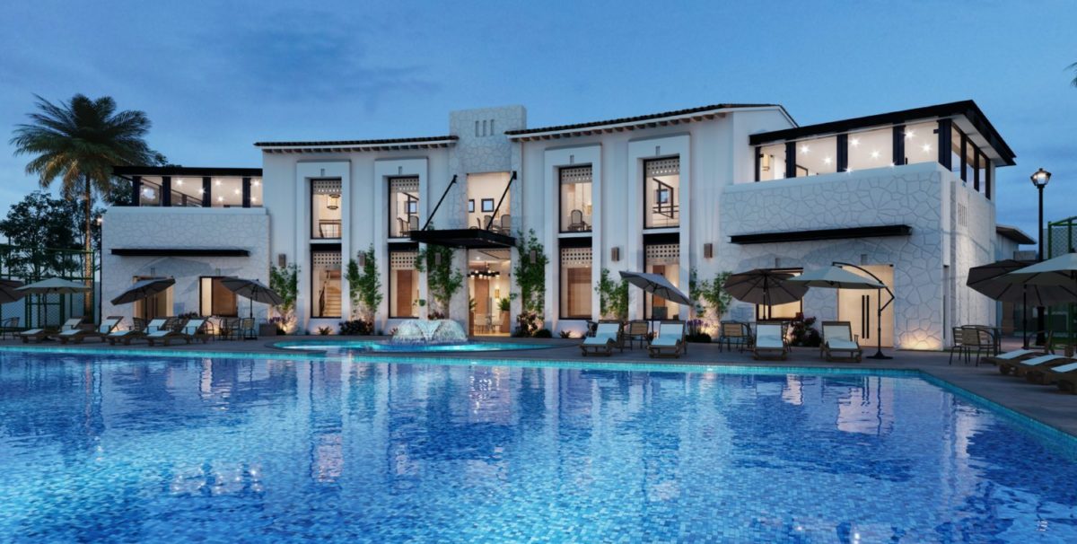 a hotel with a large swimming pool in the foreground