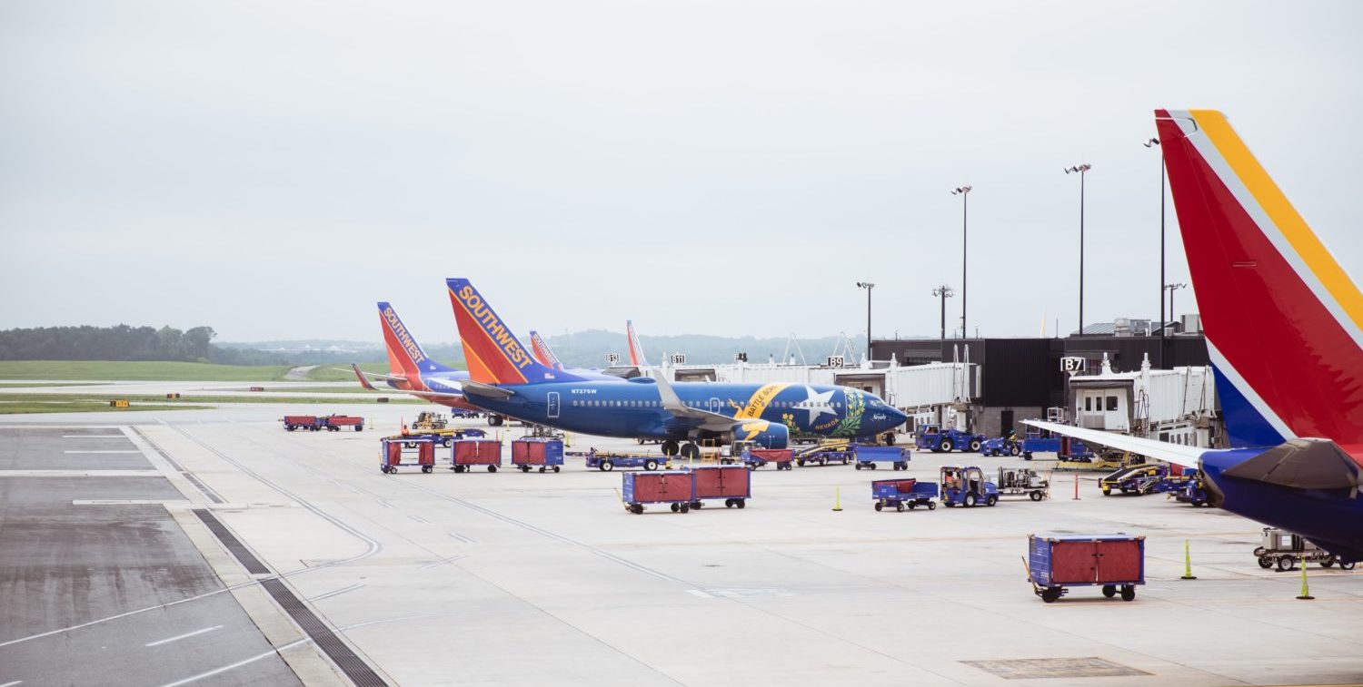 southwest airplanes parked at a gate