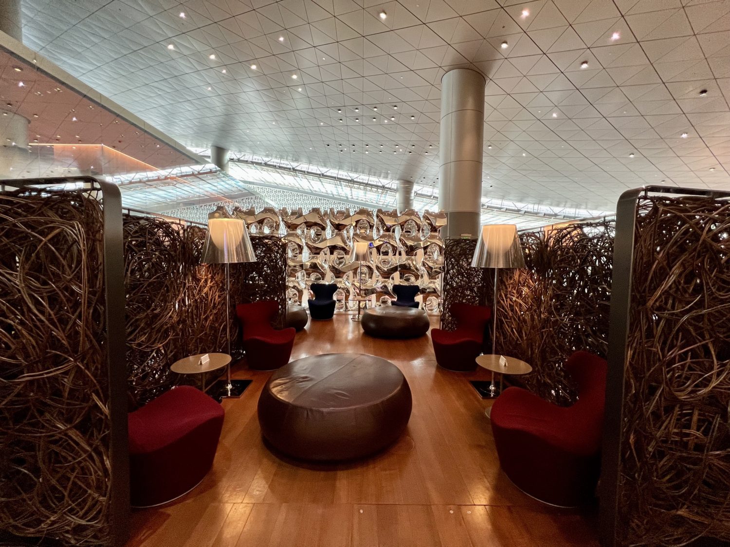 red armchairs in front of wooden privacy dividers