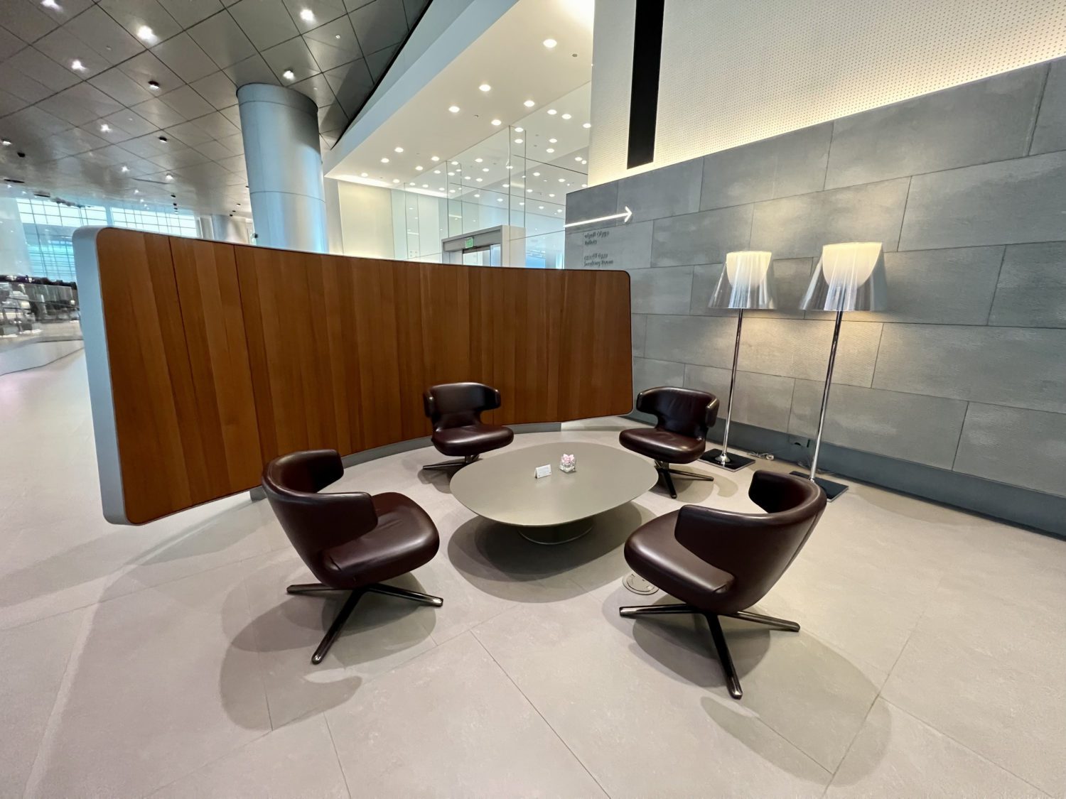 four armchairs surrounding a circular stone table