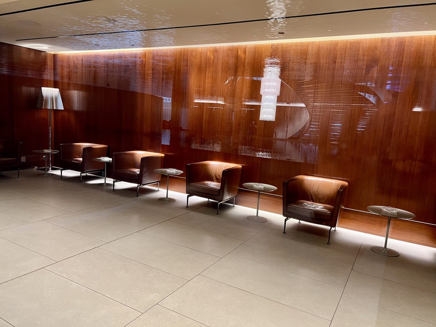 al mourjan lounge smoking room behind a glass reflection