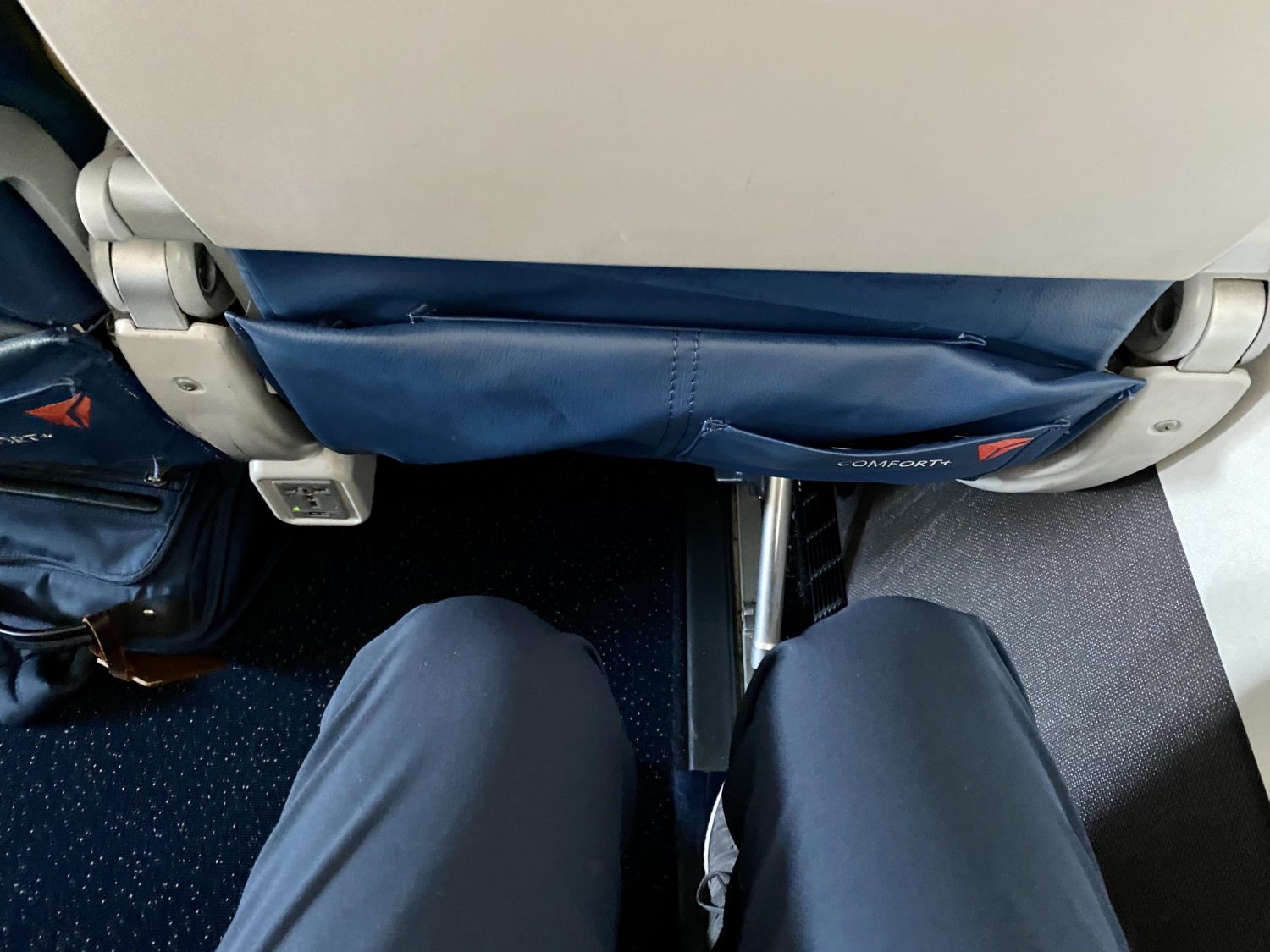 The legroom afforded to travelers in Delta Comfort Plus. 