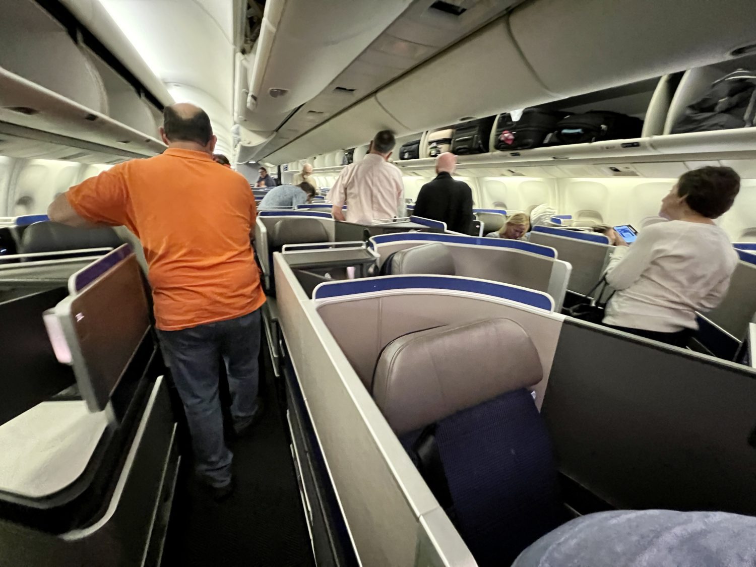 passengers boarding the plane through business class