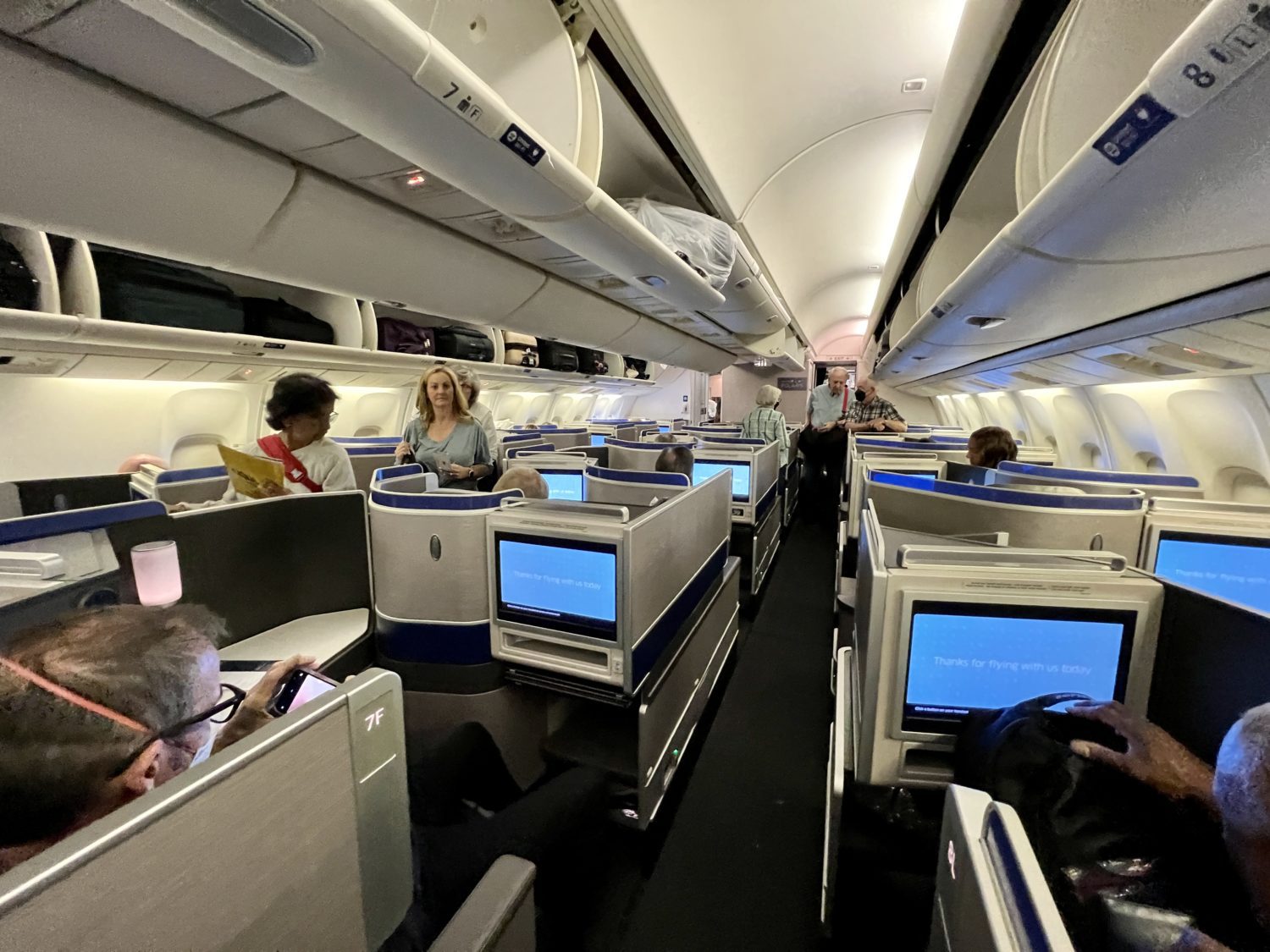 passengers standing in business class