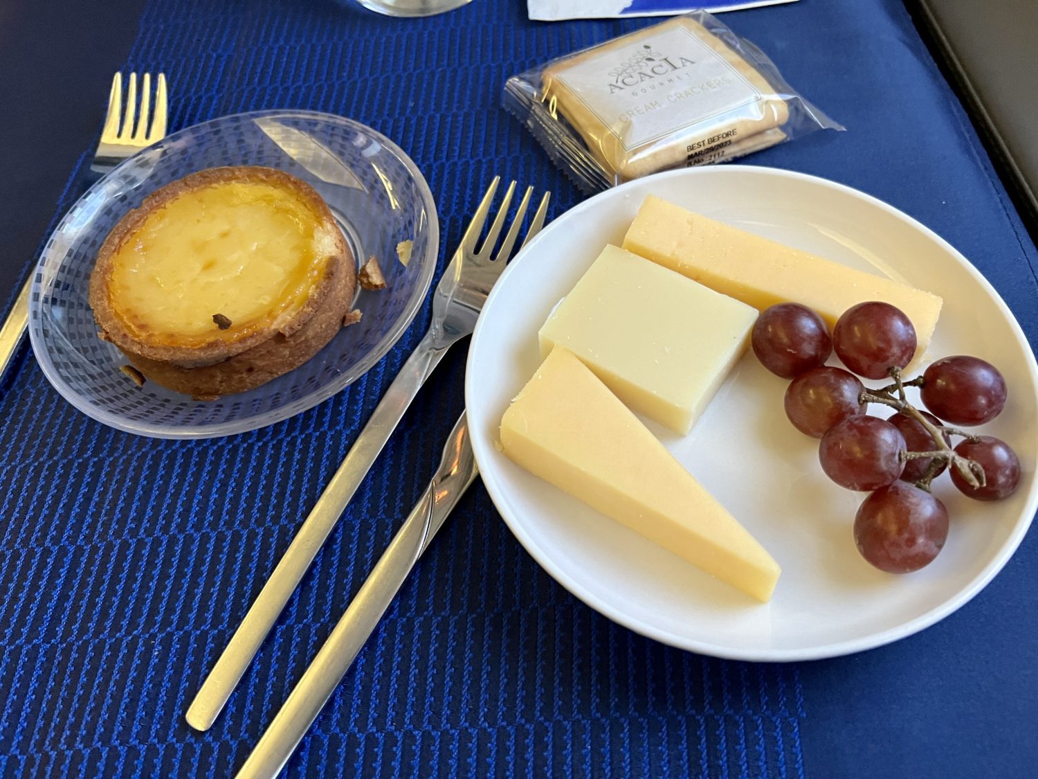 portuguese egg tart and small cheese plate