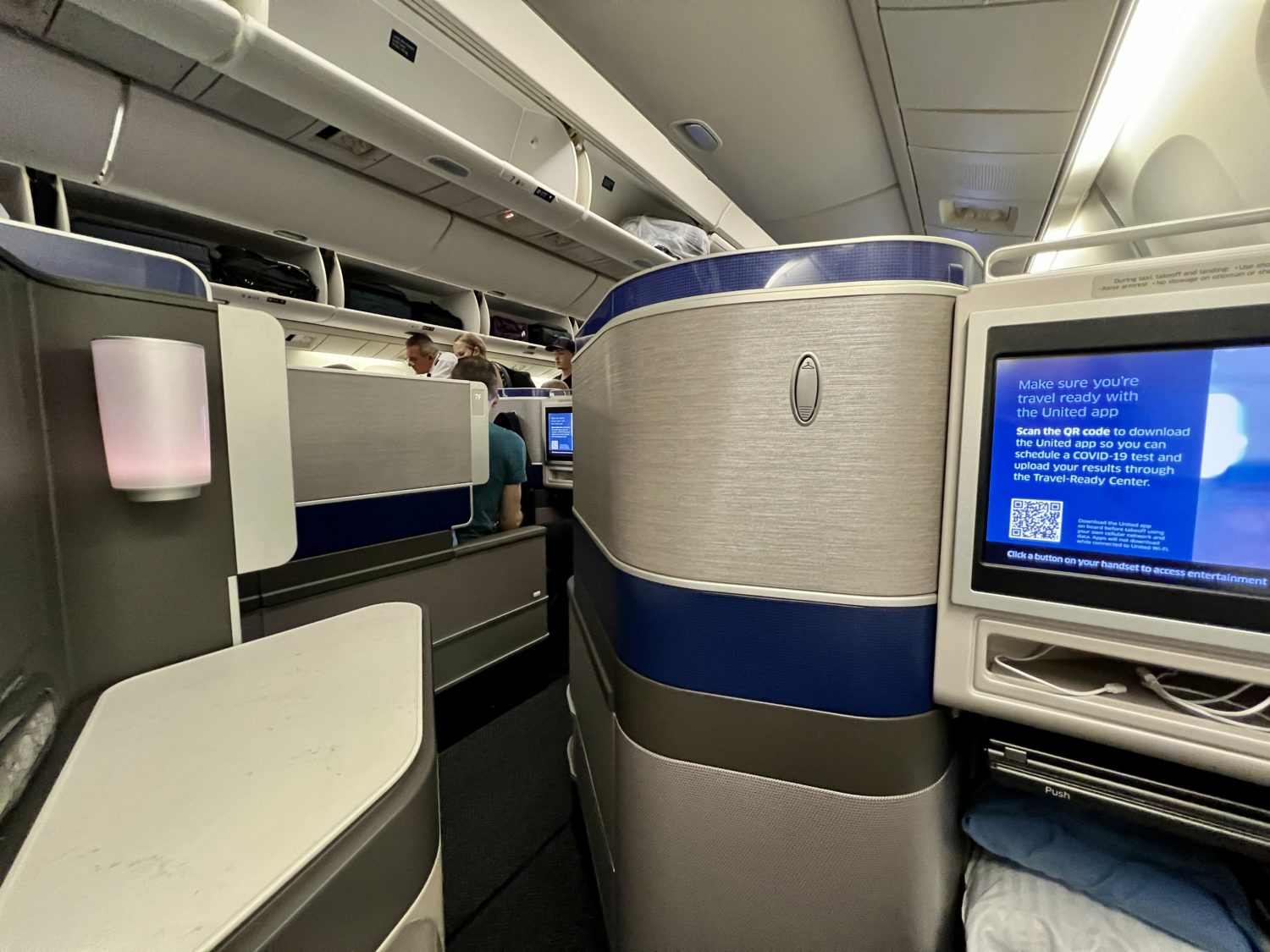 view into the aisle from a business class seat
