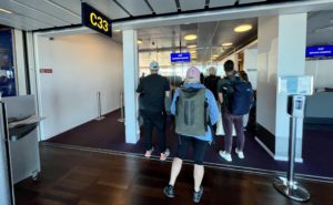 Passengers wait to board a flight at the Copenhagen Airport at gate C33. 