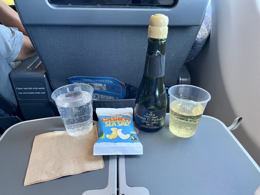 sparkling wine and package of sea salt cashews 
