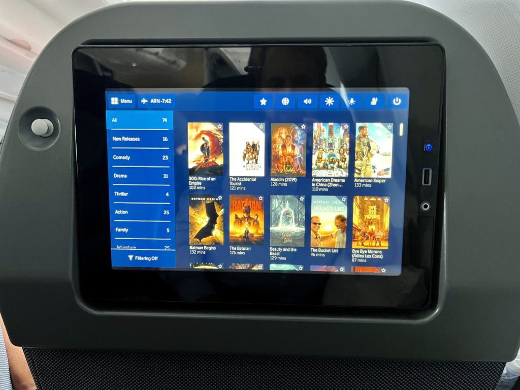 movie selections on an airplane tv screen