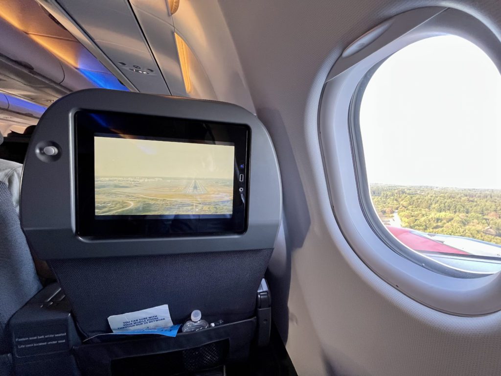 seatback screen showing the plane landing via camera