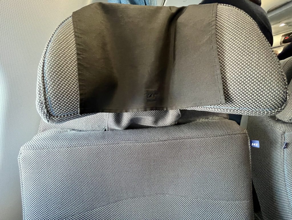 adjustable headrest on an airplane seat
