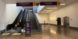Departures sign escalators and elevators at cbx bridge