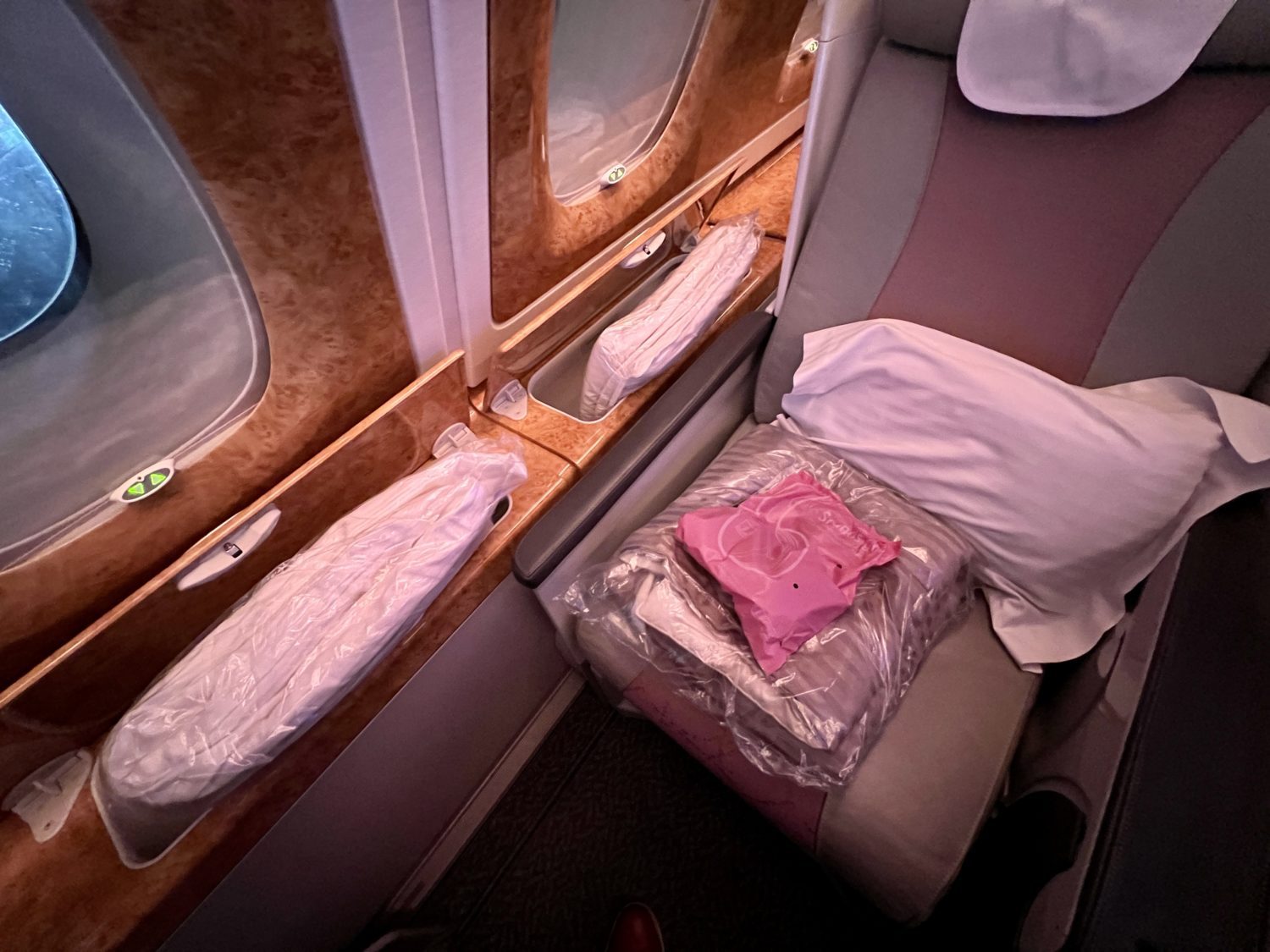 a stack of bedding materials inside of a business class suite