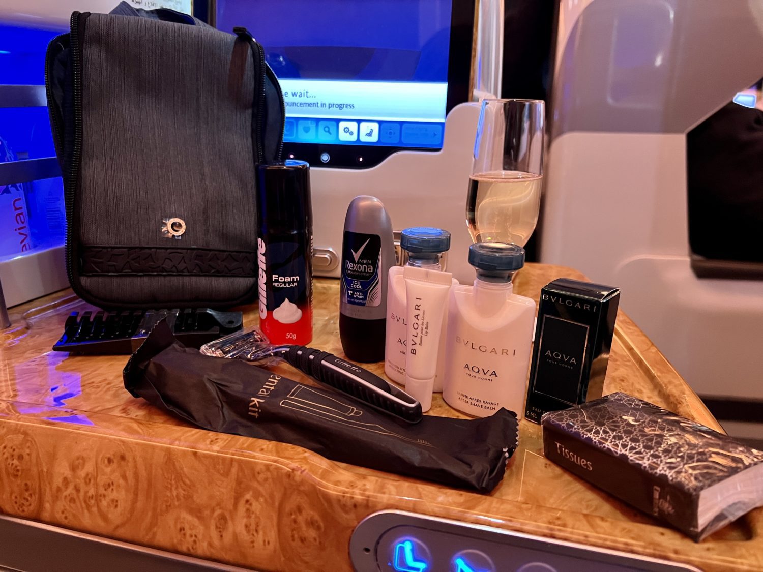 Several toiletries, socks, and eye mask alongside a large pouch