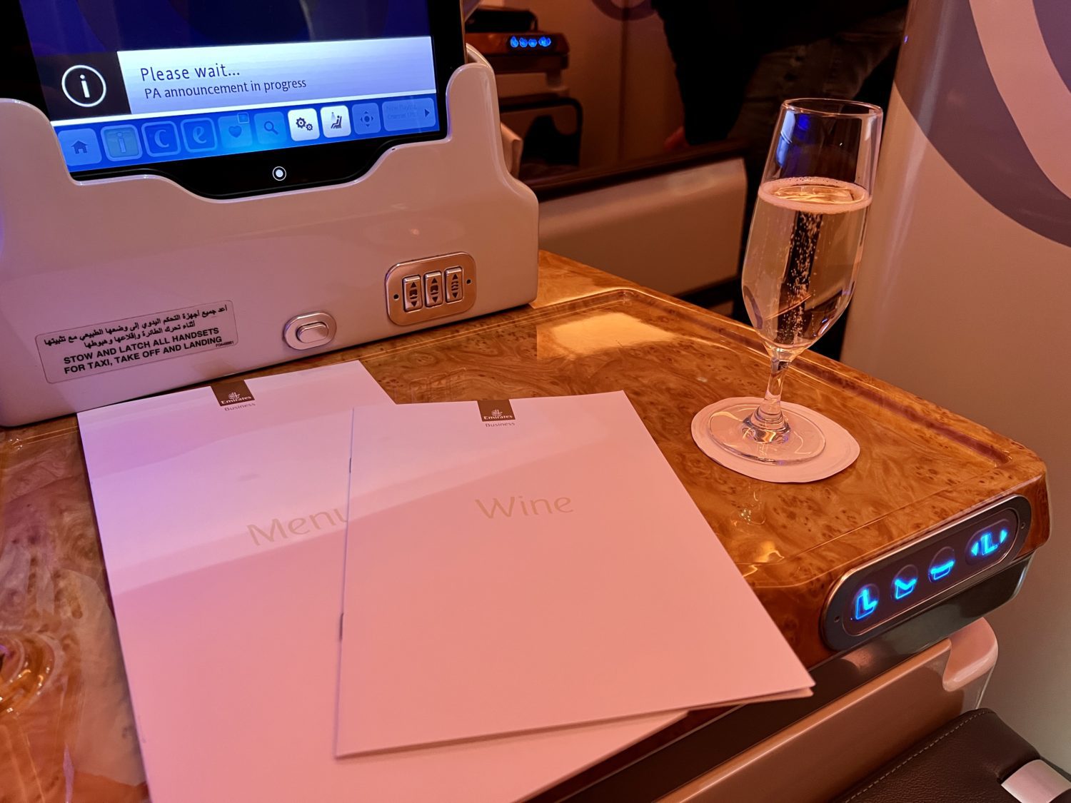 a glass of champagne and several paper menus