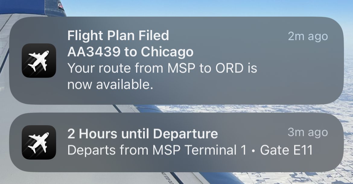 Push alerts from the Flighty app with a black airplane logo on the left and the relevant information in the alert on a smartphone. 