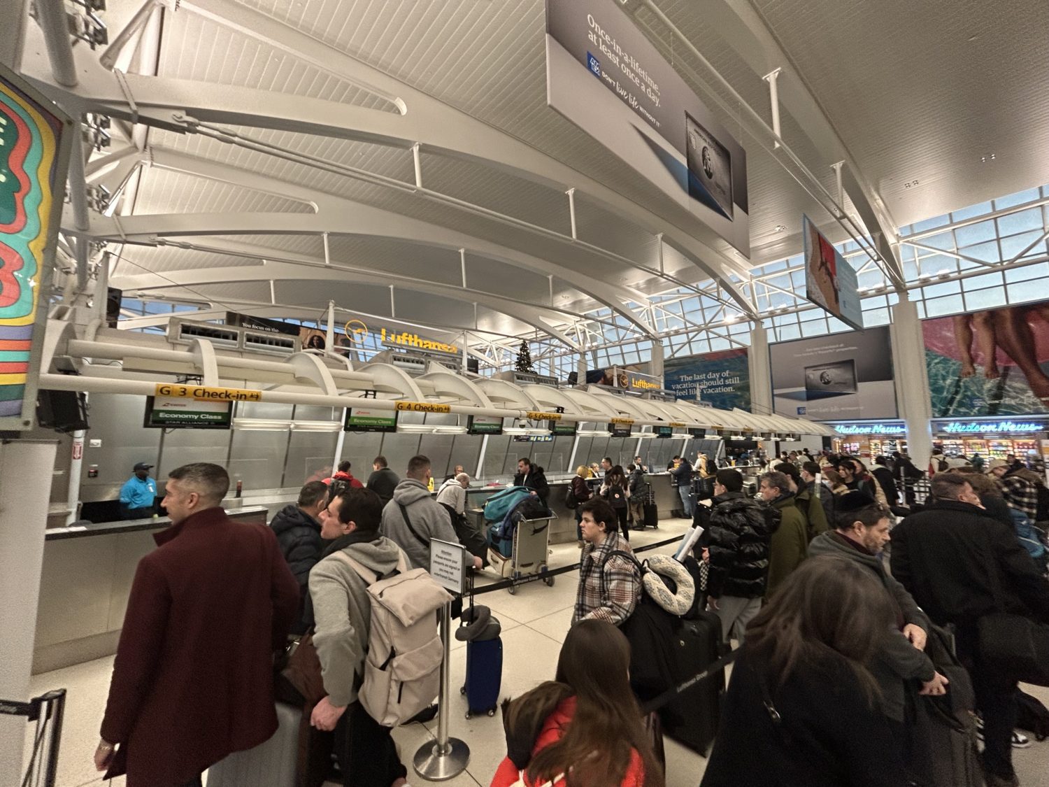Travelers lined up at the Lufthansa group check-in area at JFK's terminal 1. 