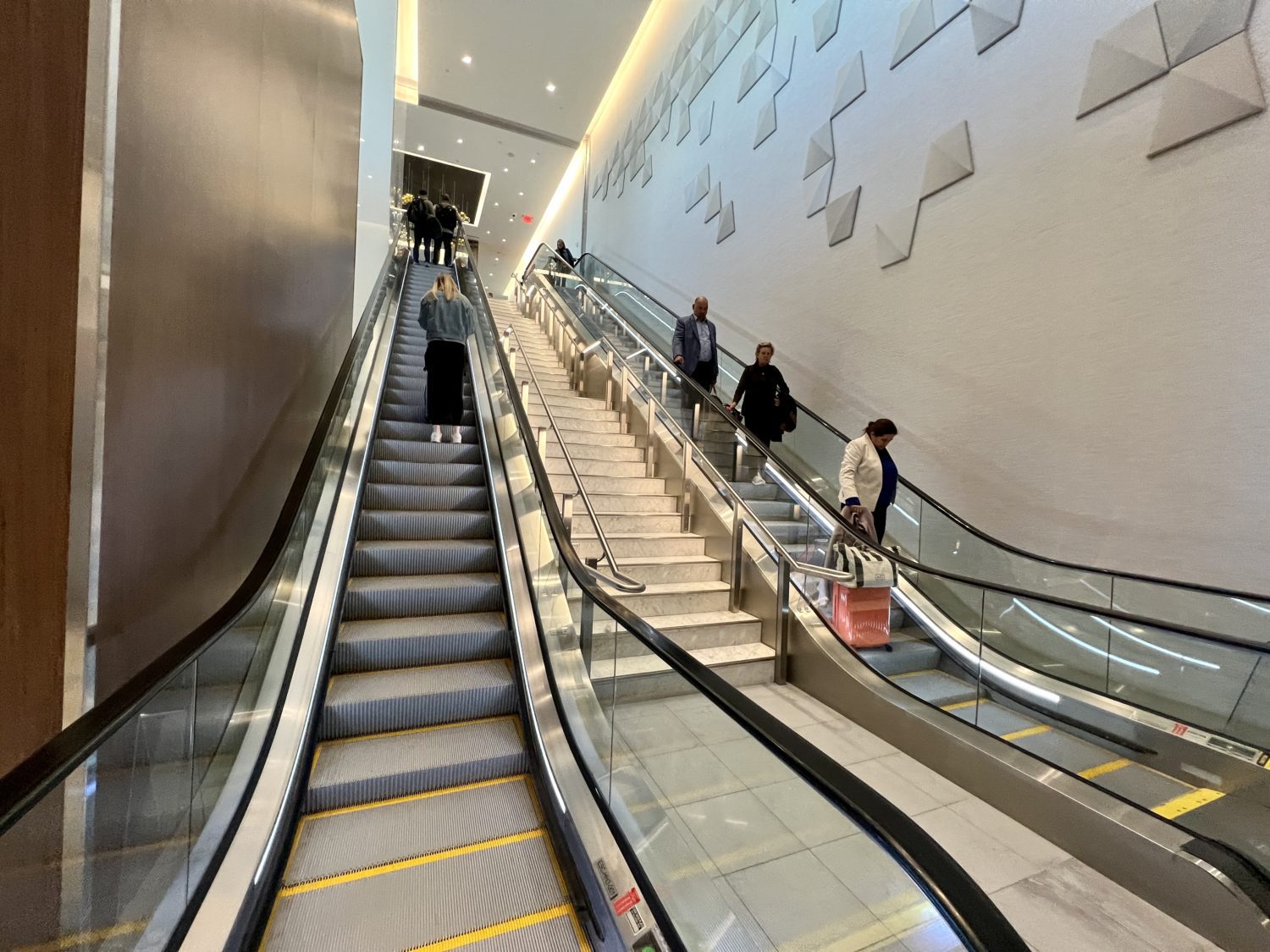 long escalators up to an airport lounge