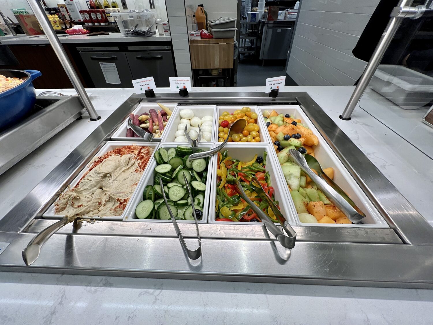 fruit, vegetables and hummus in a buffet display