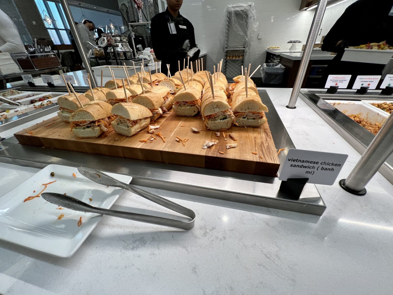 vietnamese chicken banh mi sandwiches with toothpicks sticking out the top