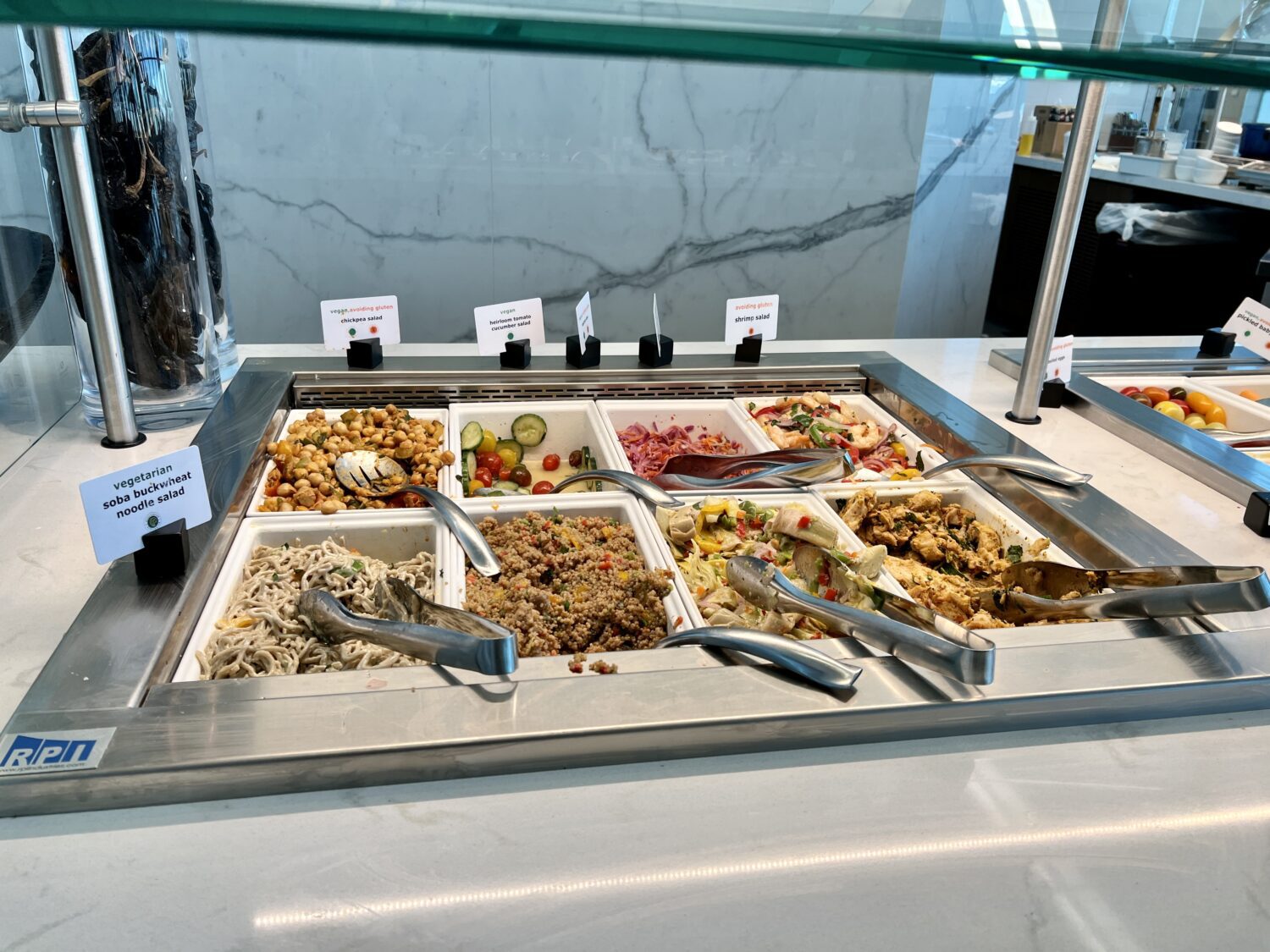 containers of cold salads in a buffet