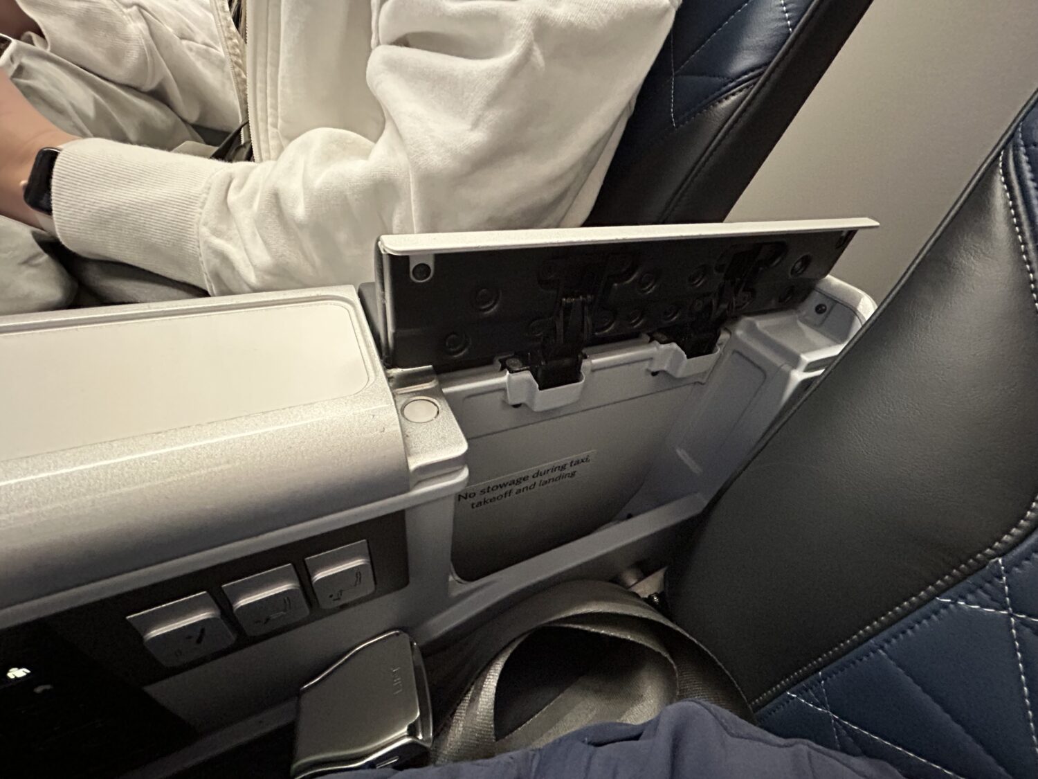 Book and tablet storage in an airplane seat. 