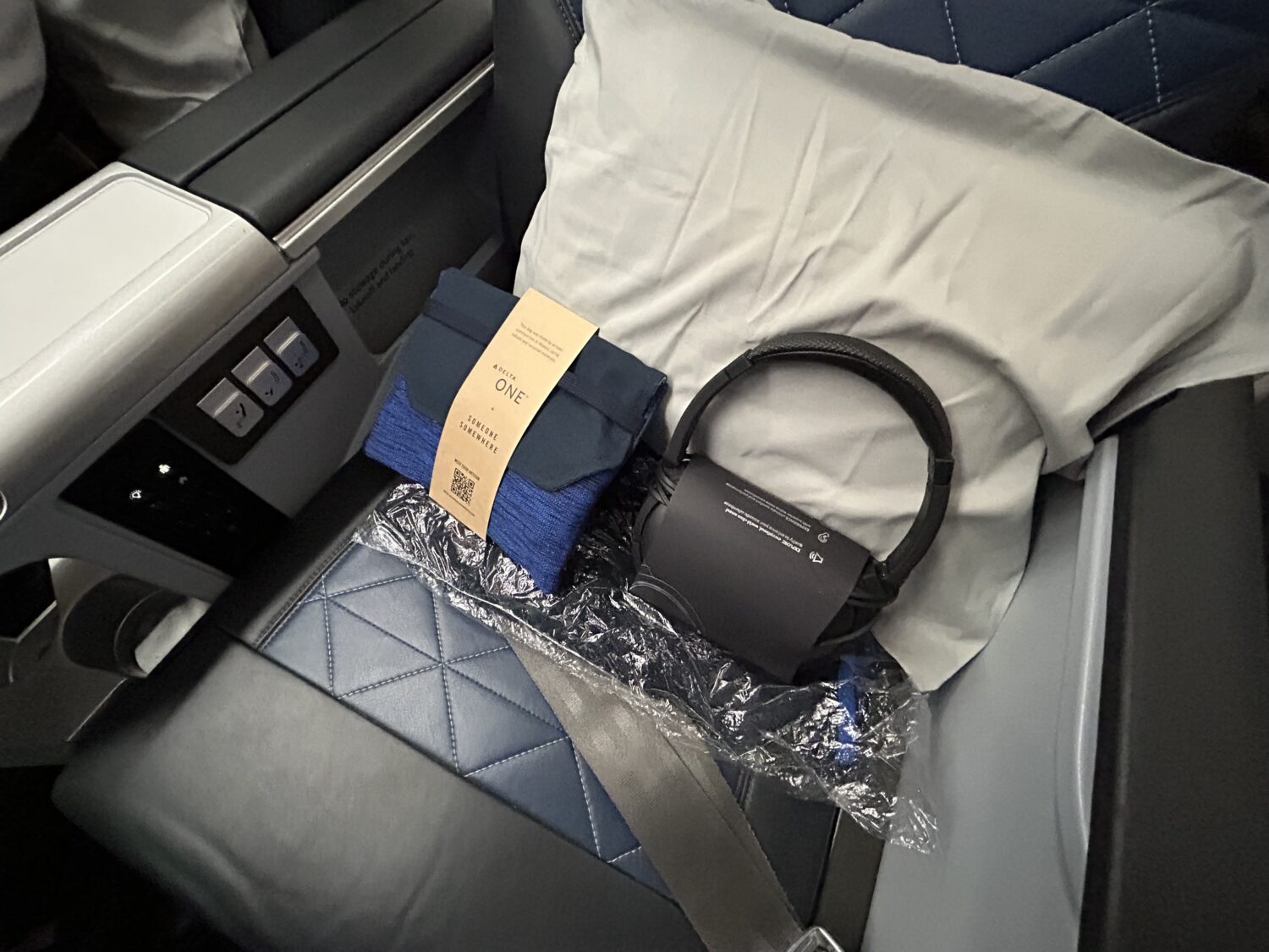 Amenities for Delta Premium Select customers sitting on an airplane seat