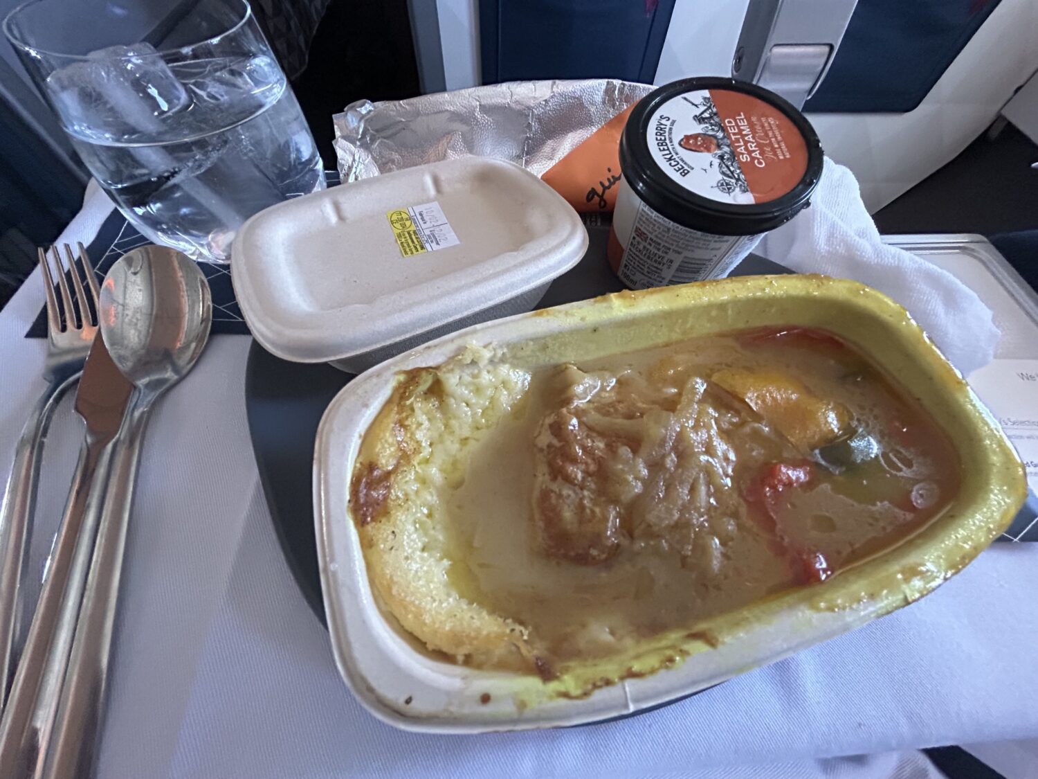 a platter of food on an airplane tray