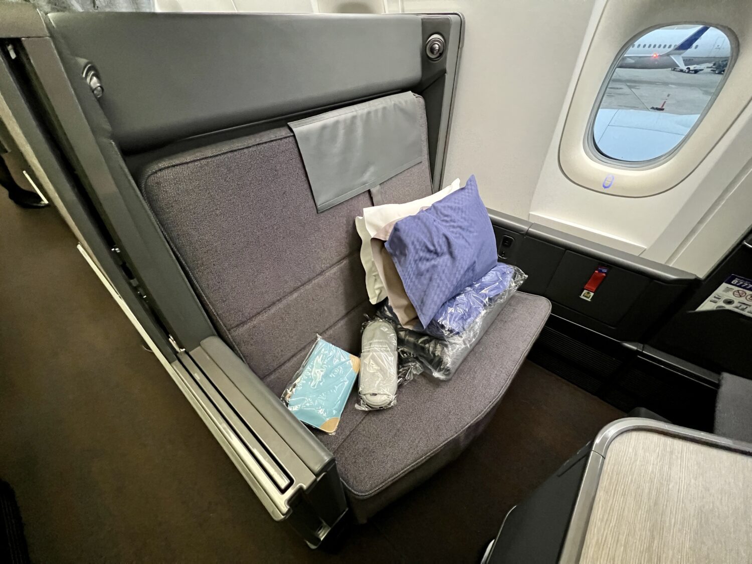 ana business class suite with amenities on top