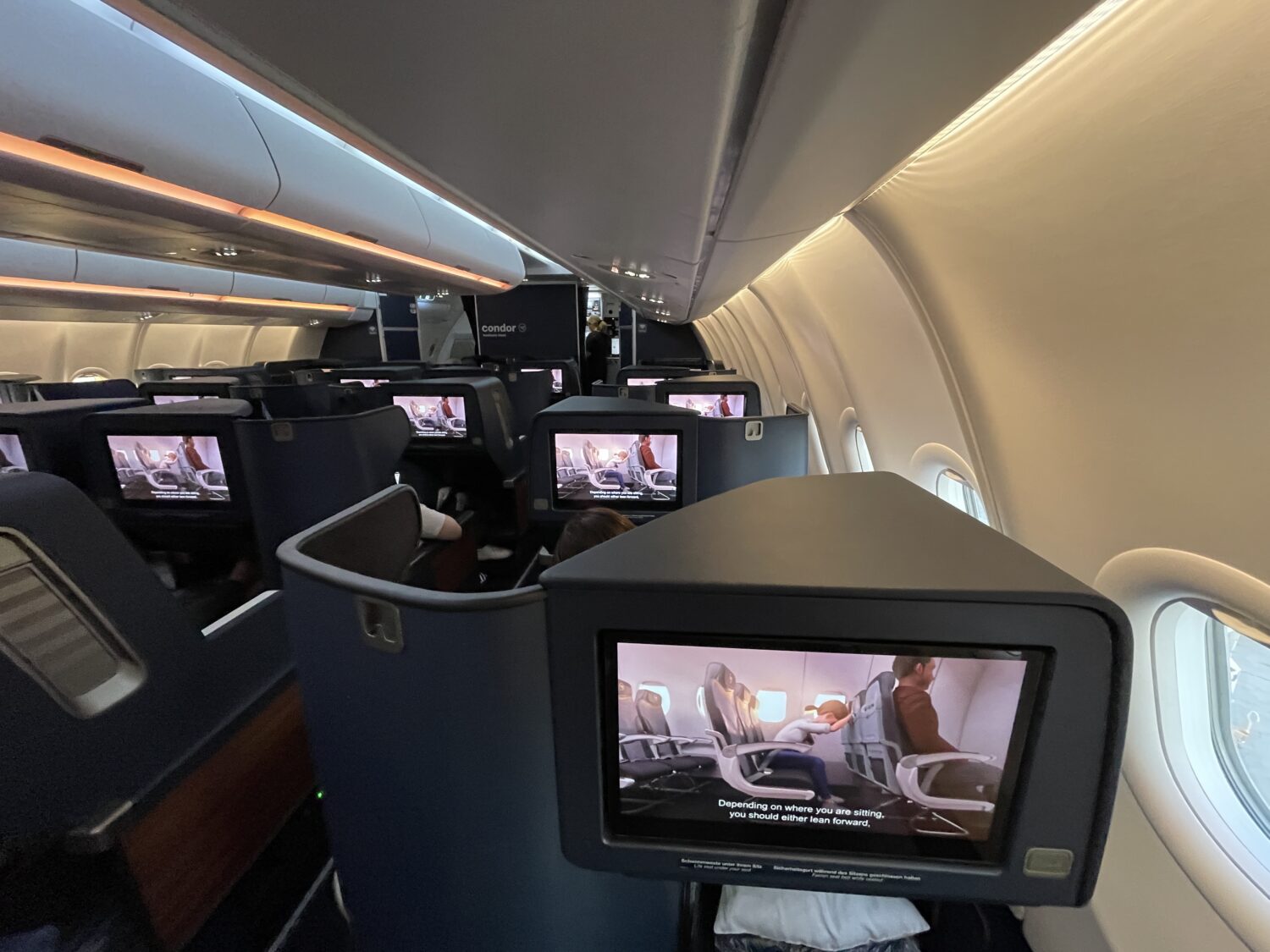rows of business class seats on an airplane