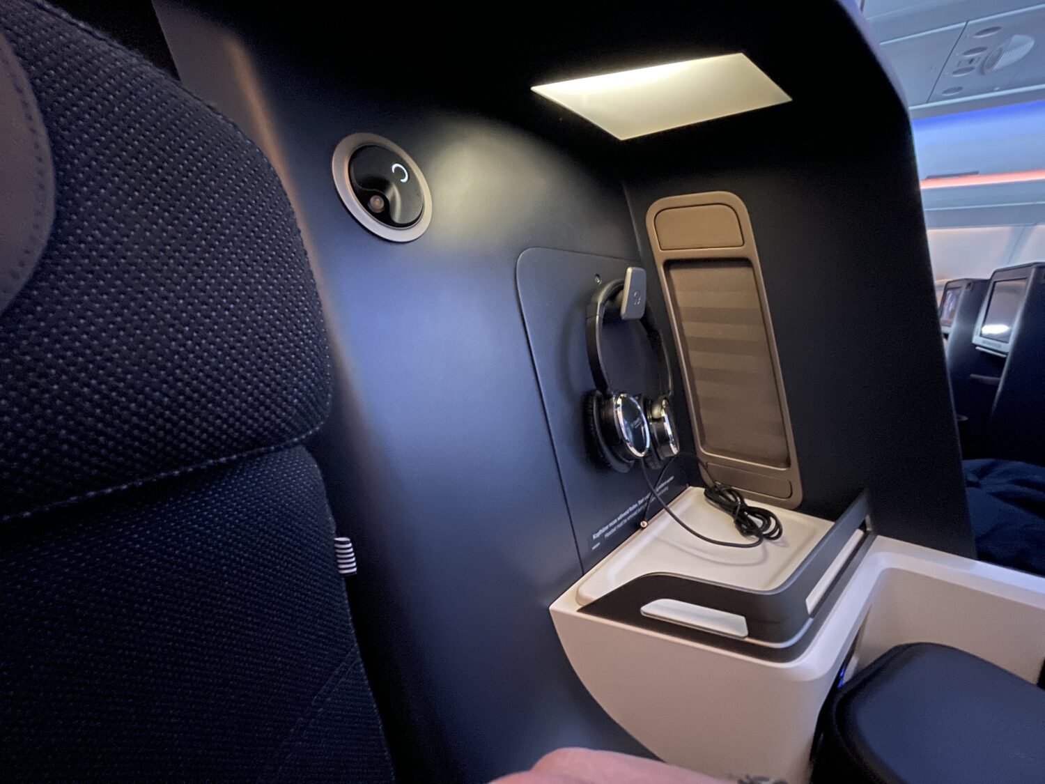 headphones at a navy business class seat 