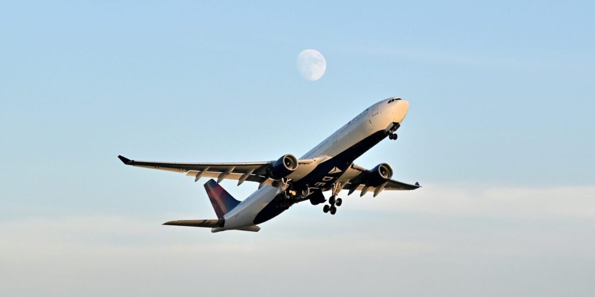 delta plane with moon