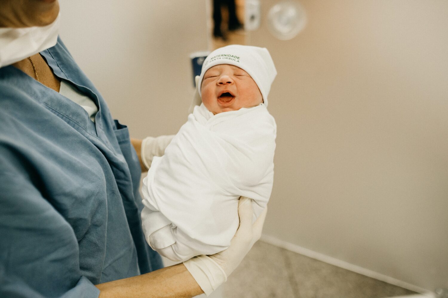 newborn baby being held