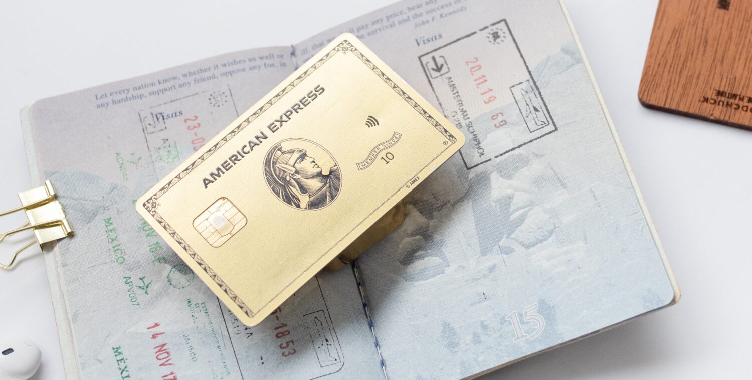 Amex Gold Card on top of an open passport