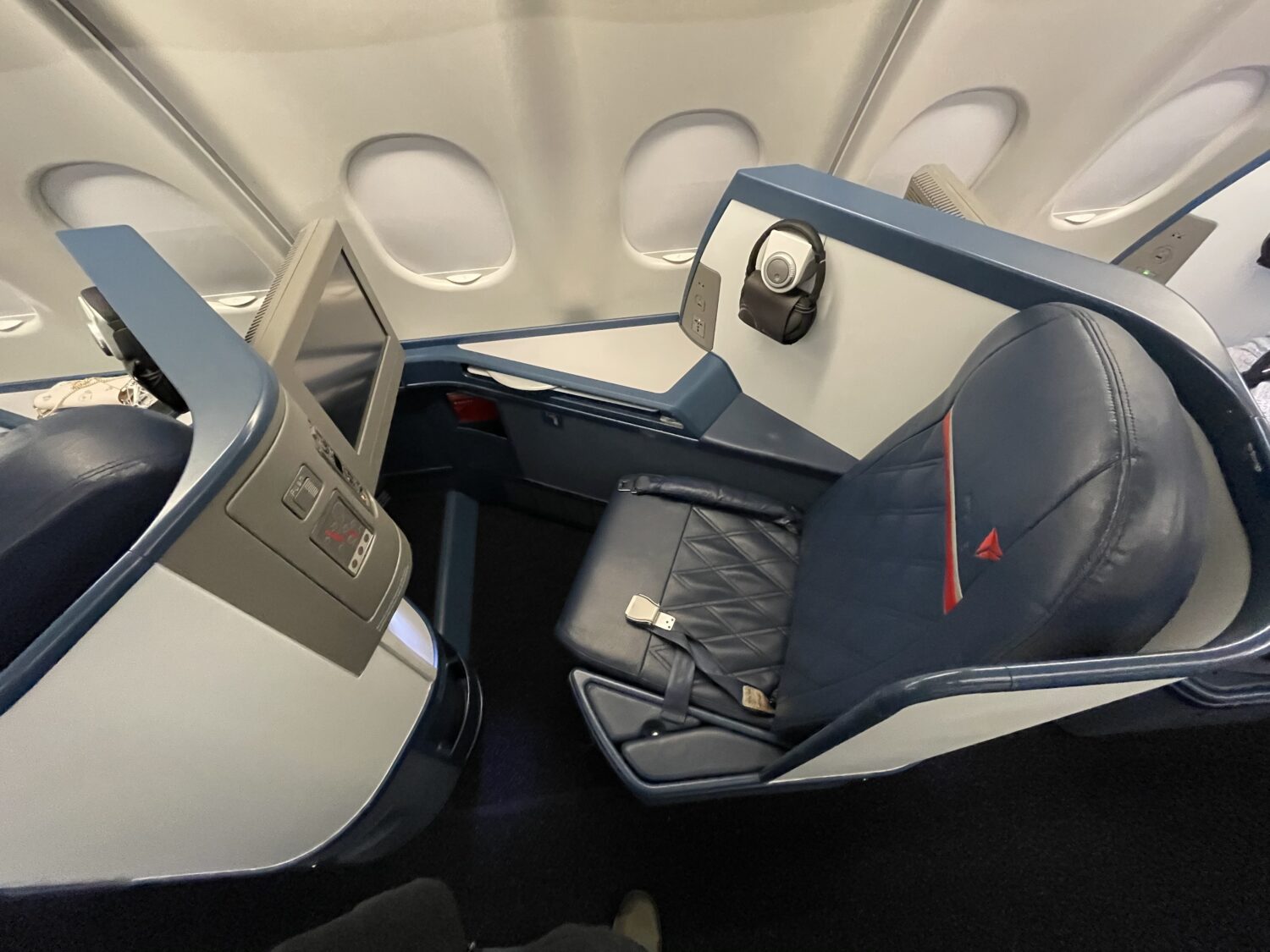 an old blue business class seat from overhead