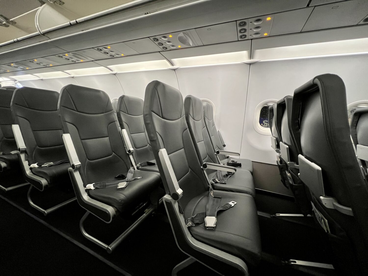 several rows of dark gray airplane seats