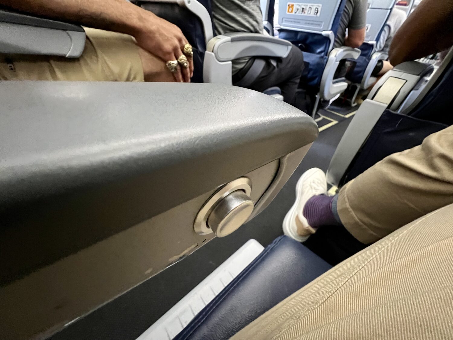 button to recline on an airplane seat