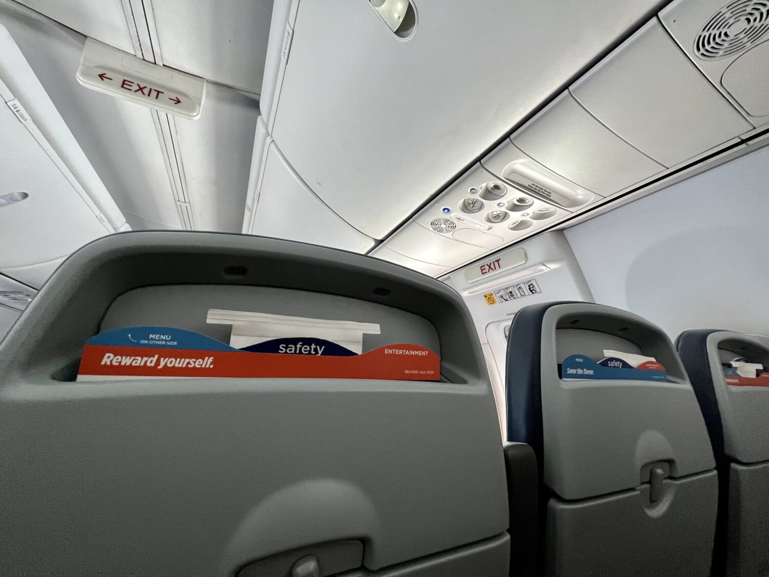seatback of plane seats with literature