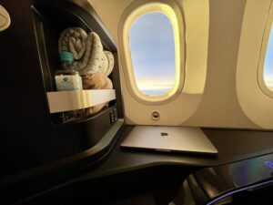 blanket and water bottle in a compartment