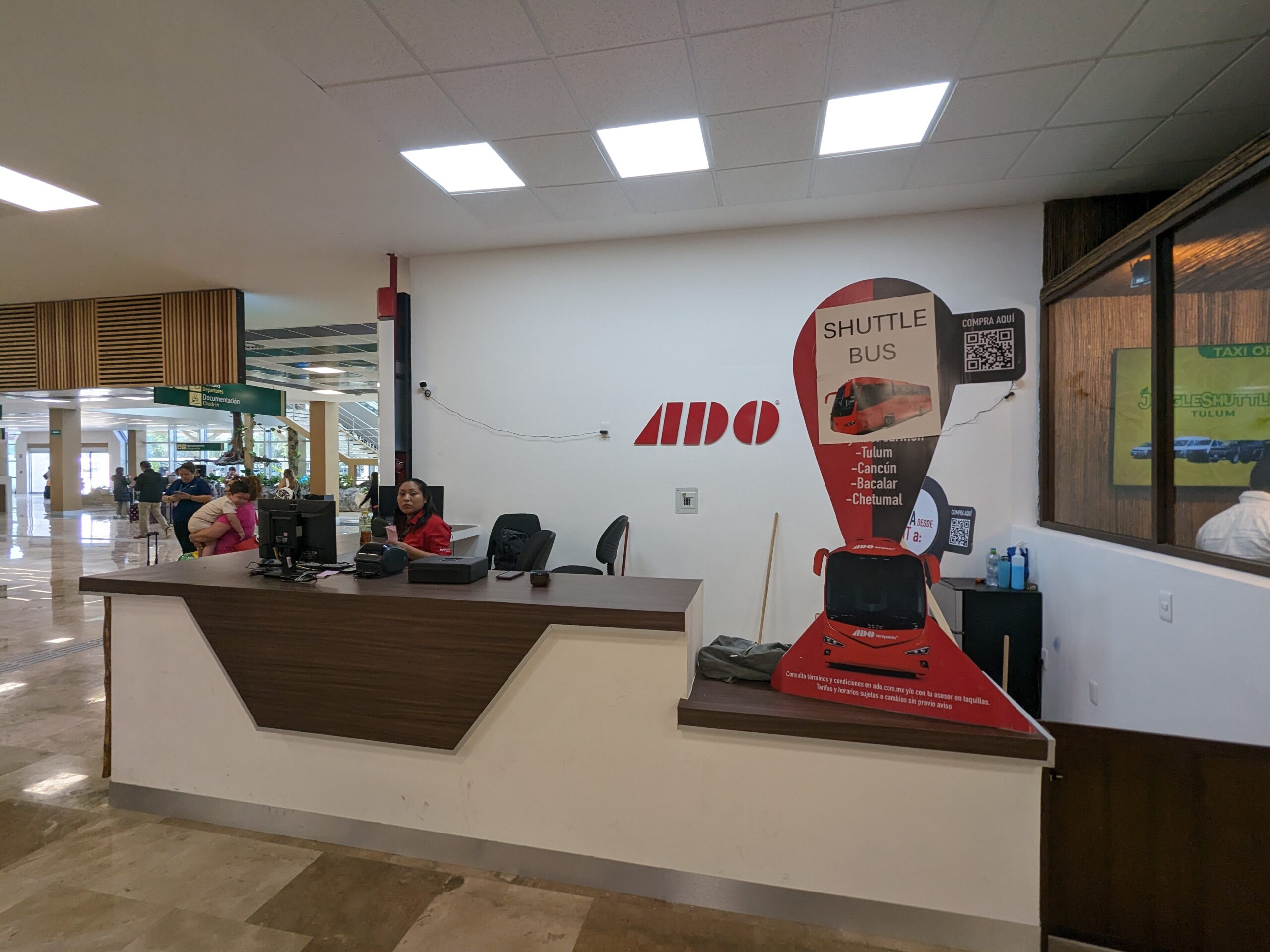 ADO Shuttle Bus booth at Tulum Airport
