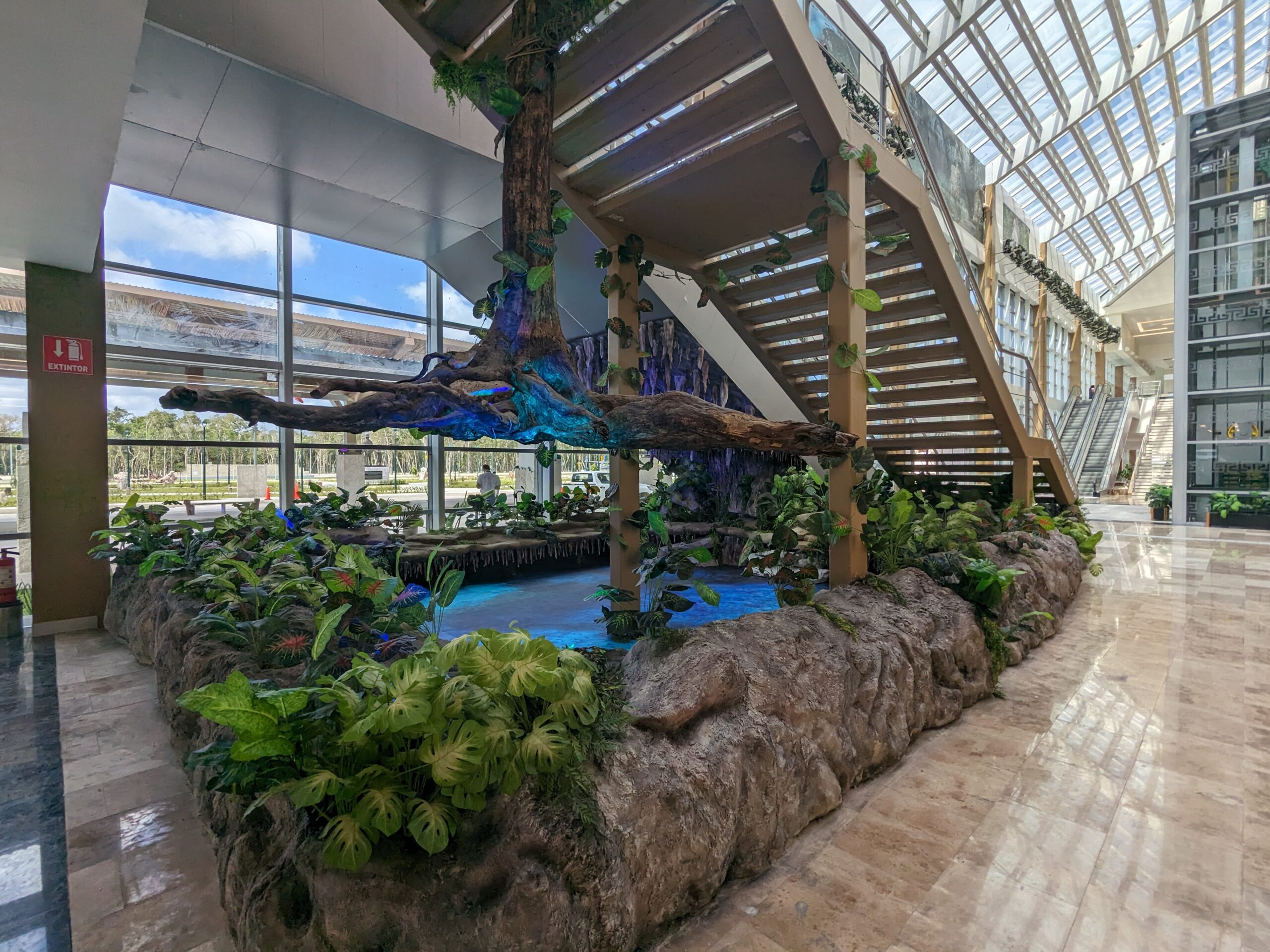 Tulum Airport staircase with nature decorations