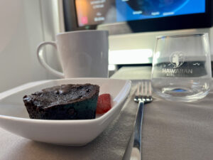 brownie and coffee flying Hawaiian Airlines first class