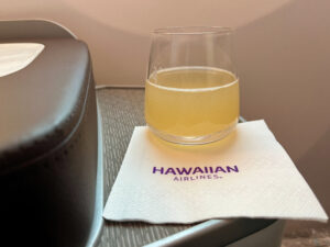Hawaiian Airlines pre-departure beverage, prosecco with guava juice